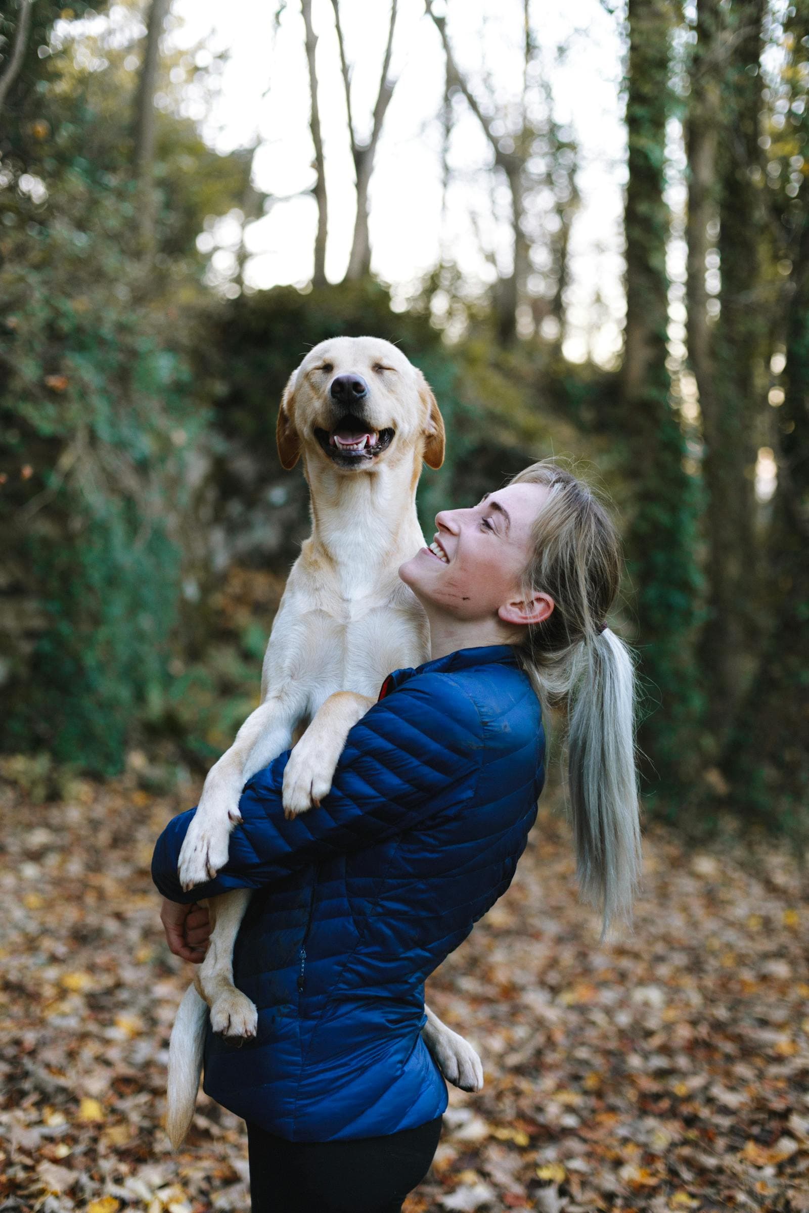 Woman playing with her dog outside